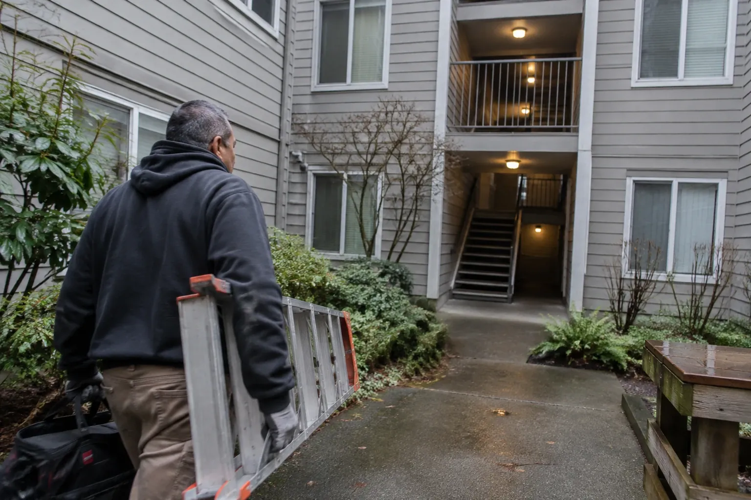 Technician arriving at a Seattle apartment building