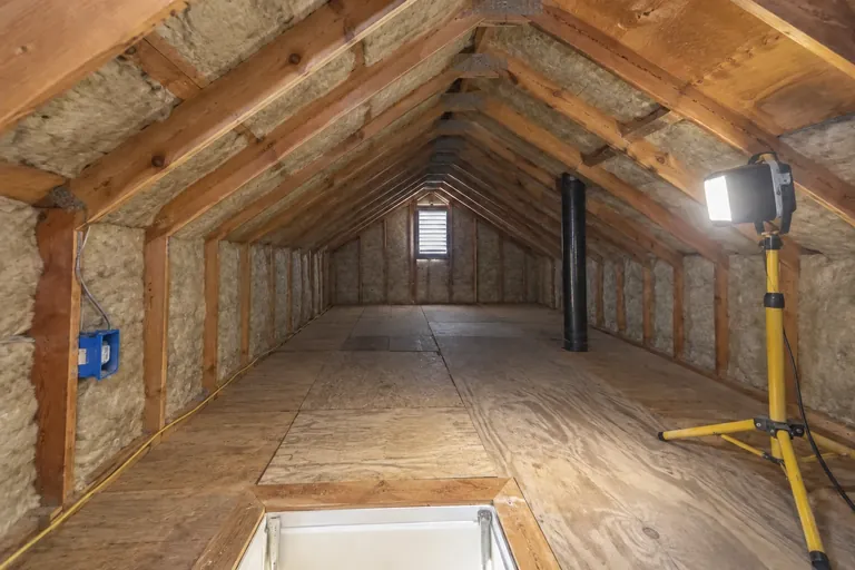 After: Every bay filled with mineral wool and the box sealed before drywall goes back